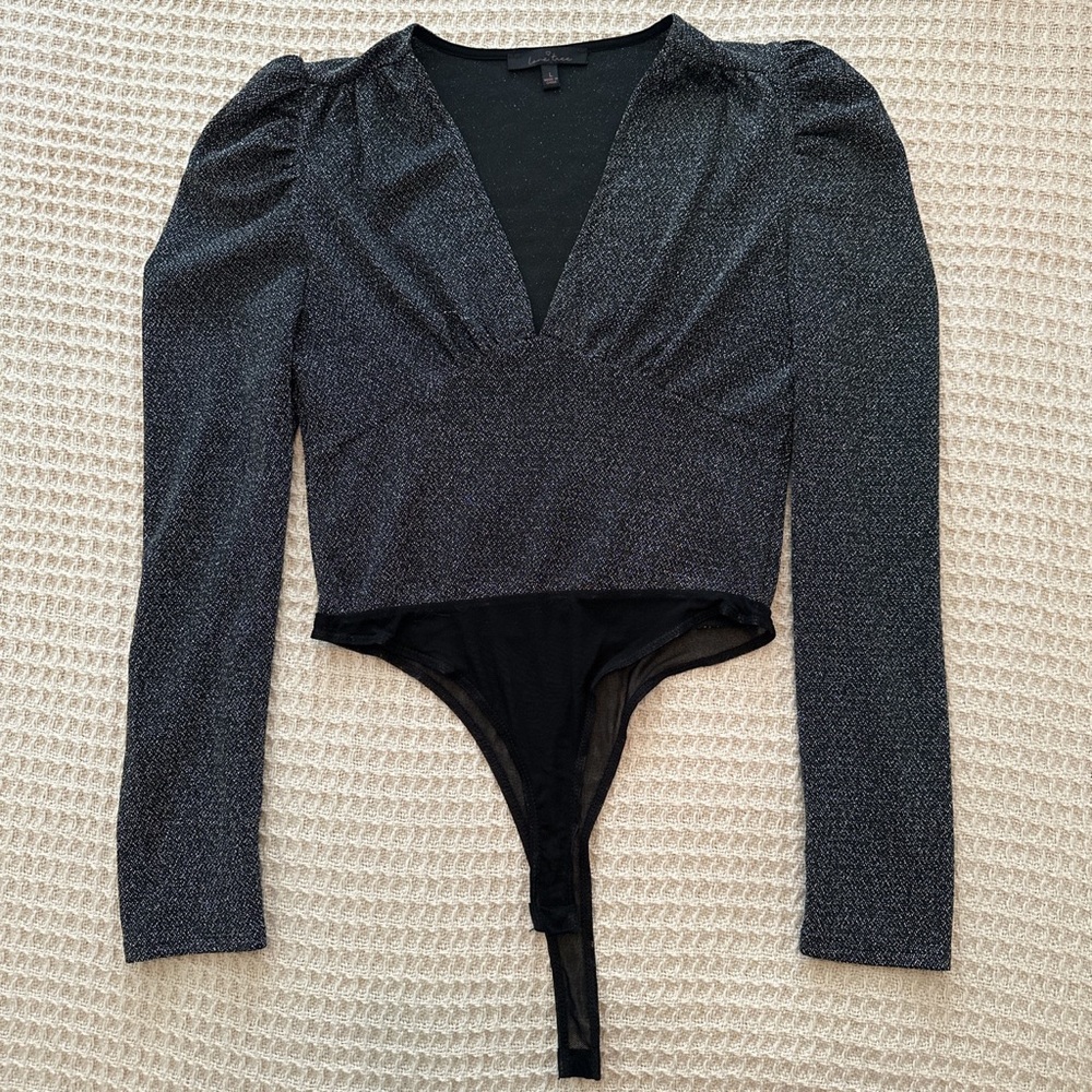 Black glitter body suit. Size large. Lightly worn.